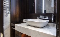 Luxurious bathroom in 2021 Sunseeker Manhattan 68 yacht with modern sink and elegant design.