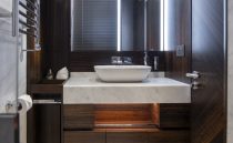 Luxurious bathroom in 2021 Sunseeker Manhattan 68 yacht with modern fixtures and elegant design.