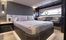 Luxurious interior of 2021 Sunseeker Manhattan 68 yacht with sleek wood cabinetry.