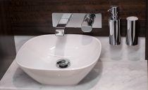 Modern bathroom sink with chrome fixtures on Sunseeker Manhattan 68 yacht, 2021 model.