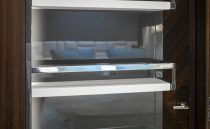 Luxury interior shelving on 2021 Sunseeker Manhattan 68 yacht, featuring sleek design and modern finishes.