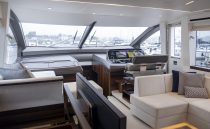 Luxurious interior of 2021 Sunseeker Manhattan 68 yacht with modern helm and seating area.