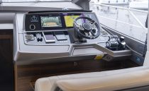 Helm of 2021 Sunseeker Manhattan 68 yacht with advanced navigation controls.