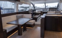 Luxurious interior of 2021 Sunseeker Manhattan 68 yacht with elegant seating and modern design.