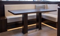 Luxurious interior of 2021 Sunseeker Manhattan 68 yacht with elegant dining area.