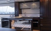 Luxurious kitchen interior of 2021 Sunseeker Manhattan 68 yacht with modern amenities.
