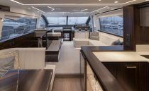 Luxurious interior of 2021 Sunseeker Manhattan 68 yacht with modern furnishings and panoramic windows.